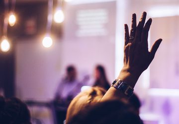 Hand raised to ask a question