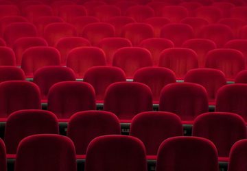 Empty red seats in a theatre
